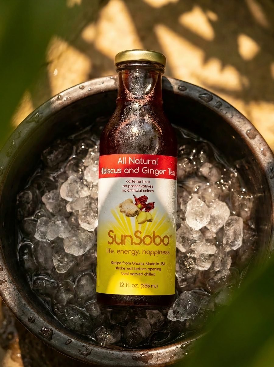 Bottle of SunSobo Hibiscus and Ginger Tea chilled in an ice bucket under dappled sunlight