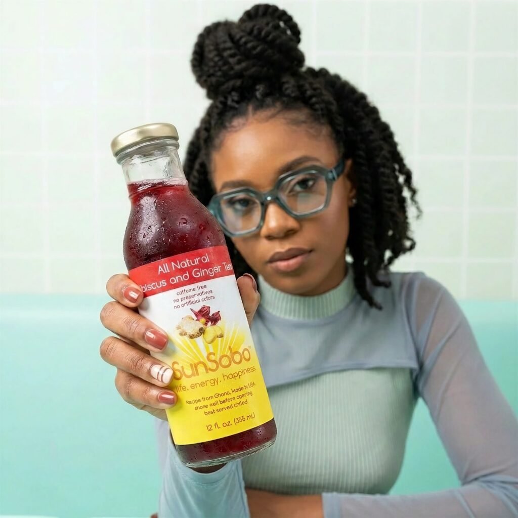 Woman holding a chilled bottle of SunSobo All Natural Hibiscus and Ginger Tea